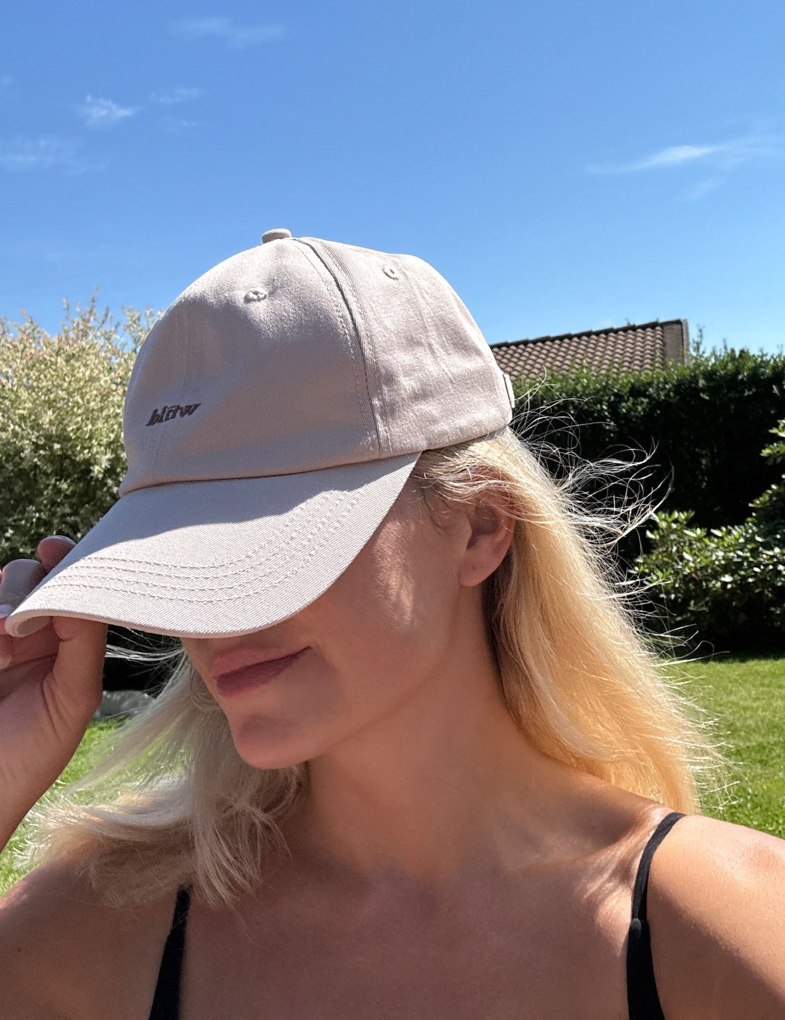 Wiild Swimwear Mahua Cap in beige color  viewed from the side on model